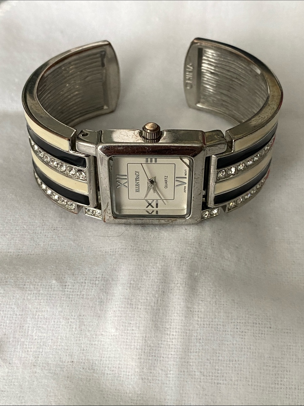 Ellen Tracy Silver and Cream Cuff Watch with Black Accents